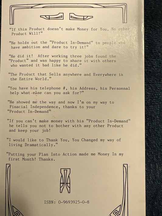Close-up of a book's back page with text and design elements.