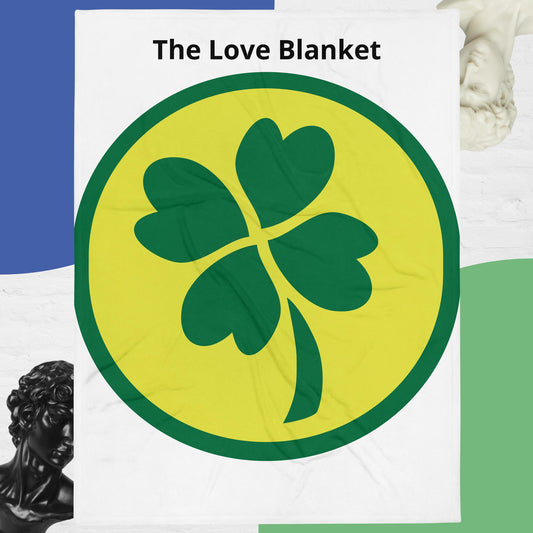 A throw blanket with a green clover design on a white background, with the text 'The Love Blanket' displayed prominently.