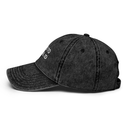Black distressed baseball cap on a white background