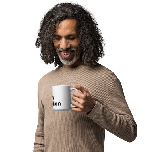 A person holding a white glossy mug with the text 'I Play Accordion' printed on it.