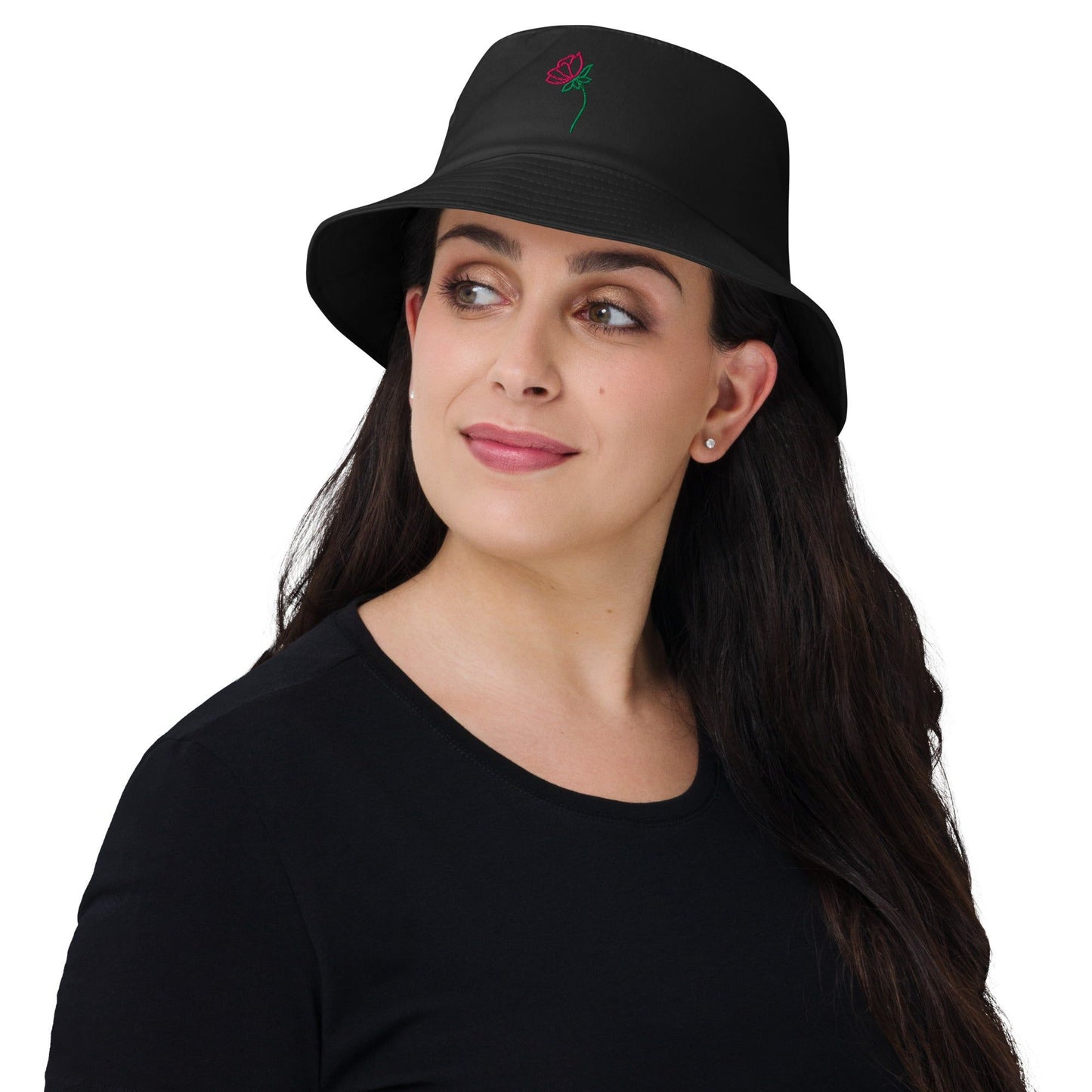 Lady wearing a bucket hat with a flower on the front